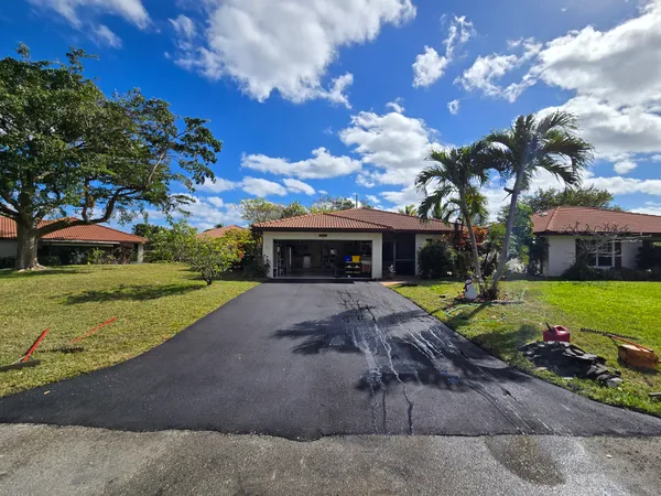 Completed asphalt driveway with proper grading